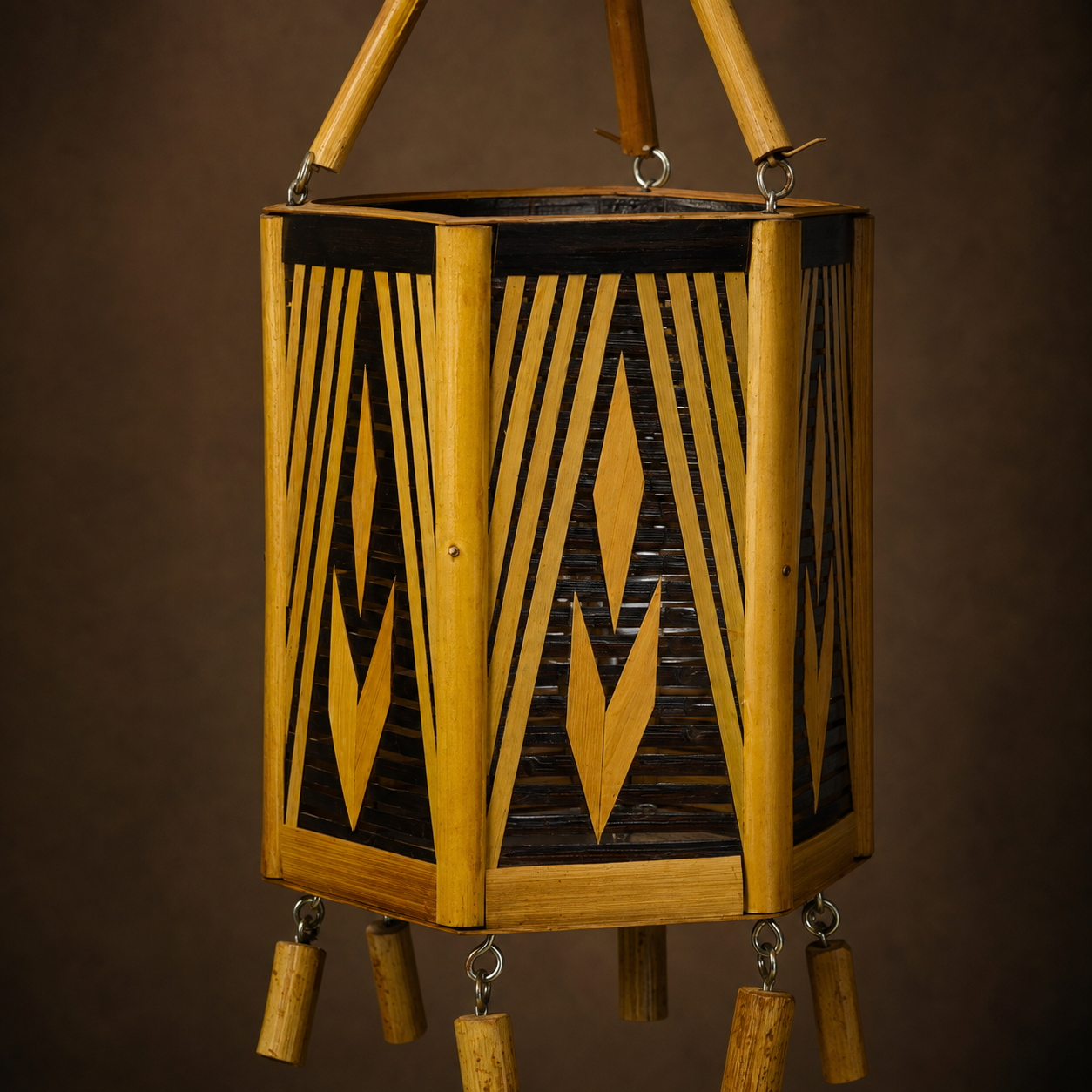 Close view of bamboo grain, woven panels, leaf inlays and handmade joinery on the Bastar lamp