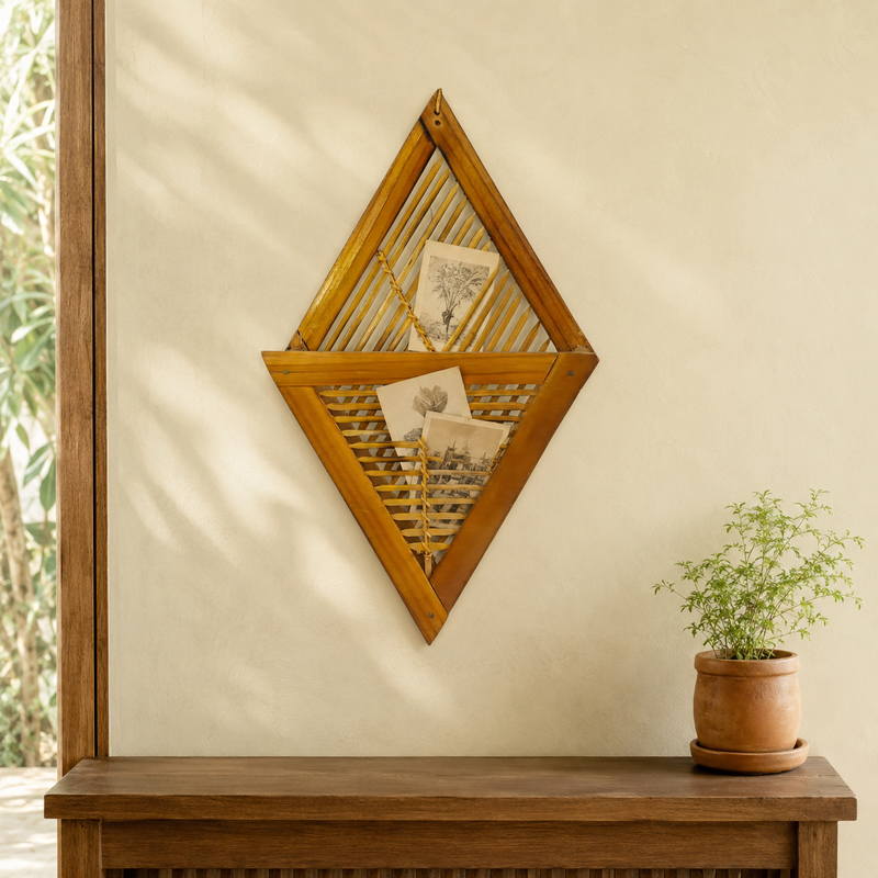 Bamboo wall frame holder displaying postcards in a warm natural home entryway