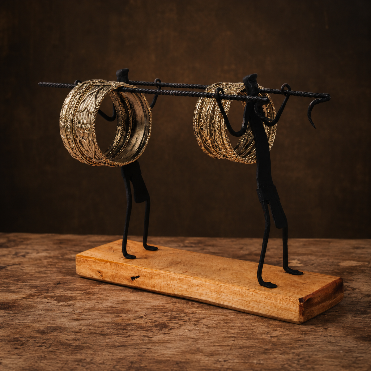 Close view of the twisted iron rods, forged supports, hooks, bangles, and wood grain