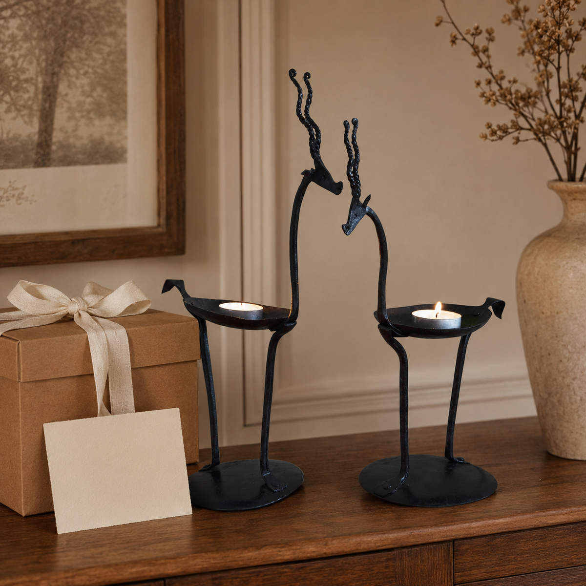 Pair of Bastar wrought iron bird candle holders presented as a handcrafted gift