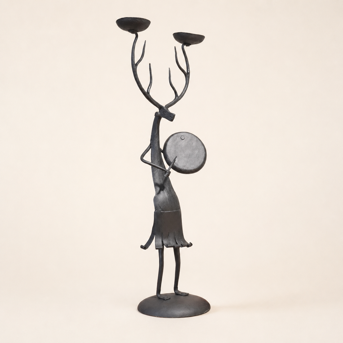 Bastar wrought iron antlered musician candle holder in a clean studio setting