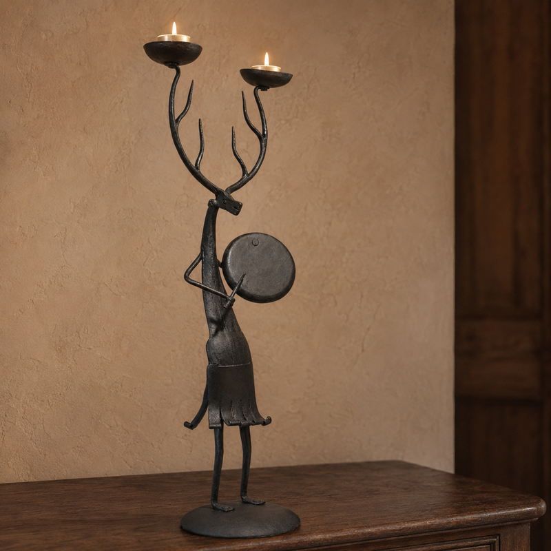 Bastar wrought iron antlered musician candle holder with two lit tealights