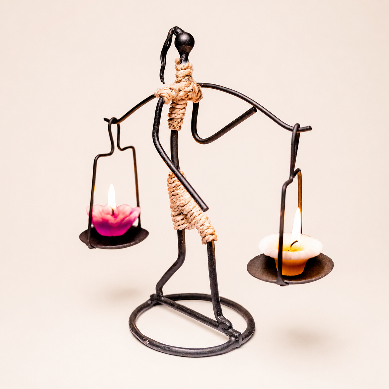 Bastar wrought iron two-candle figure holder in a clean studio catalogue setting