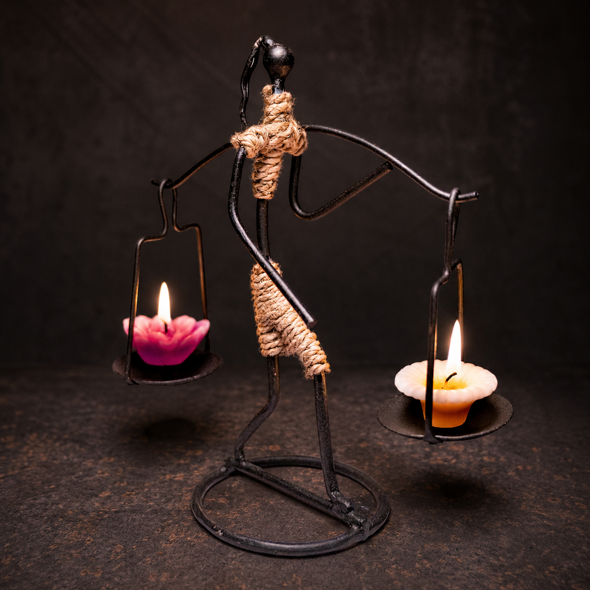 Craftsmanship view of the hand-forged Bastar two-candle figure holder