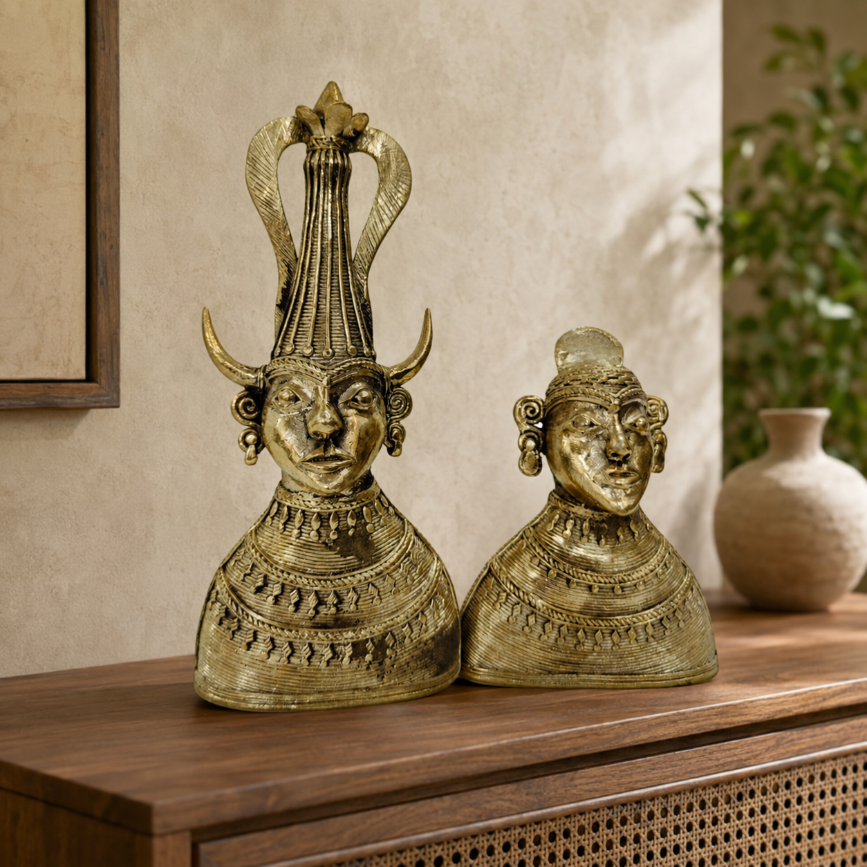 Dhokra Madia-Madin tribal couple styled on a contemporary walnut console