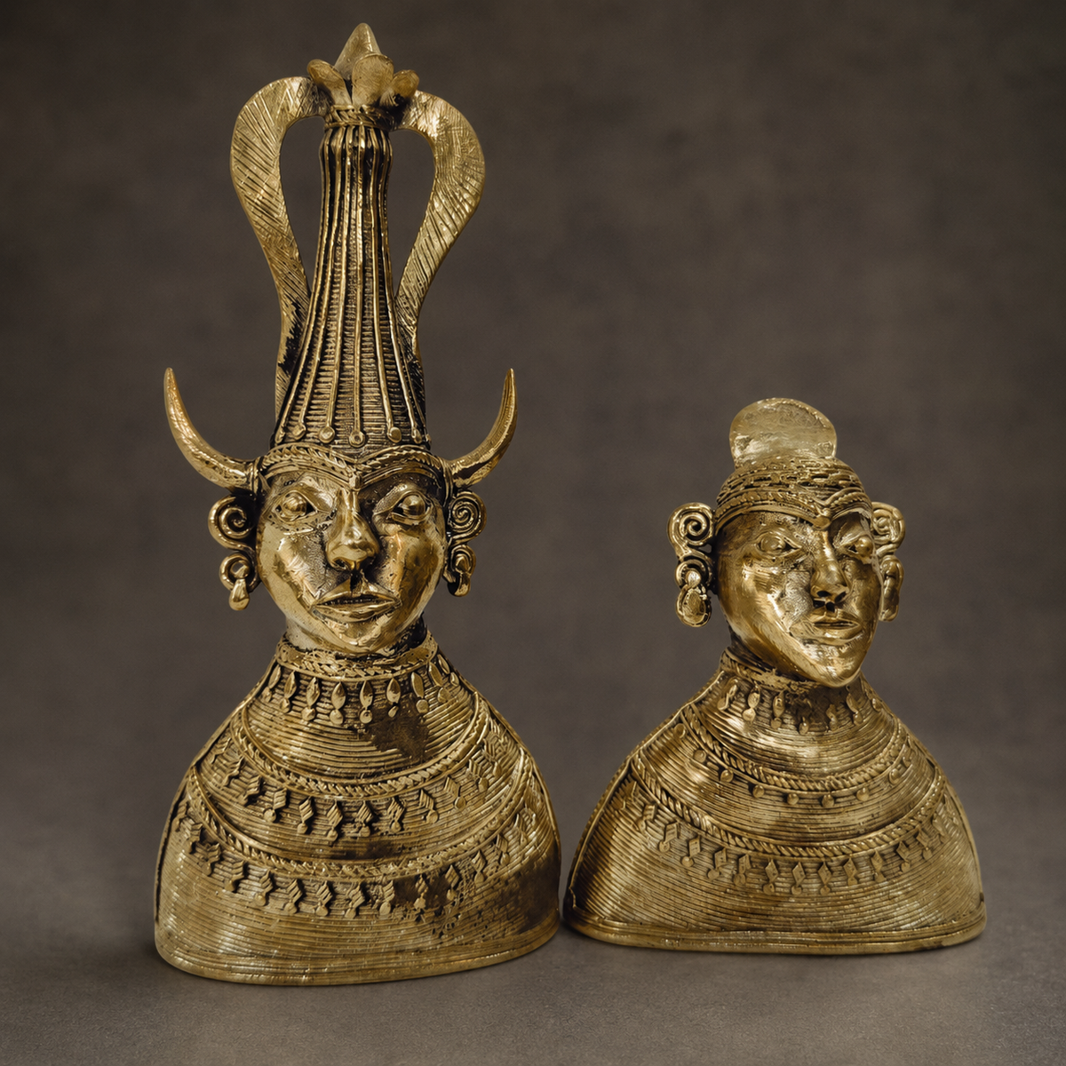Detailed studio view of the hand-cast brass Madia-Madin couple and lost-wax ornamentation