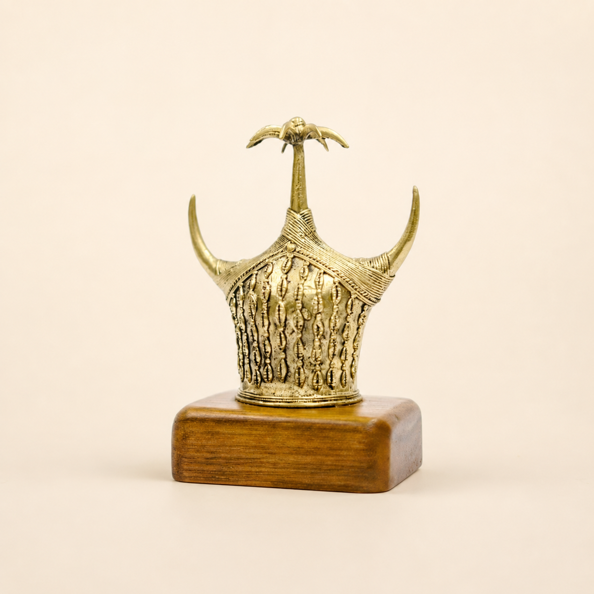 Dhokra Bison Horn memento on a warm ivory studio background