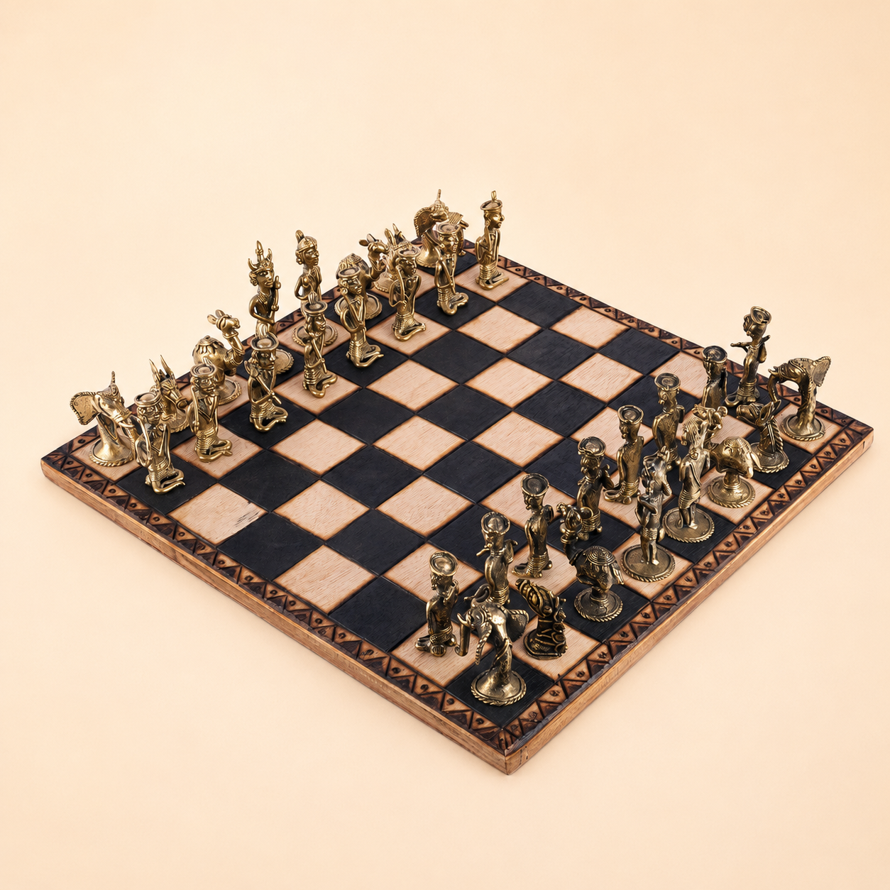 Complete Dhokra brass chess set on an engraved black-and-natural wood board against an ivory studio background