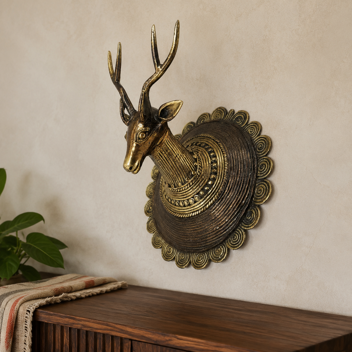 Dhokra Deer Head Design 2 mounted above a walnut console in a calm living room