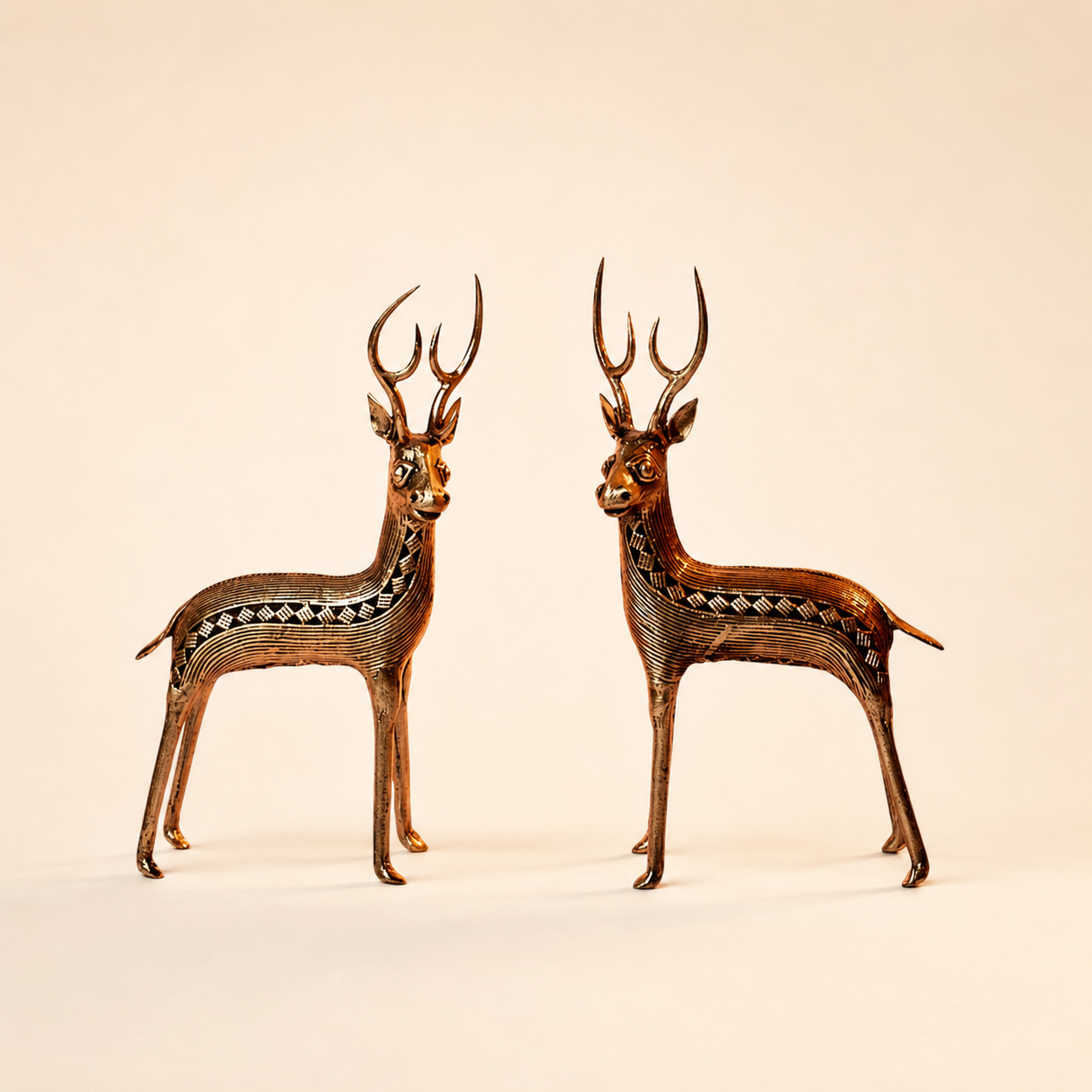 Dhokra Deer Set Design 2 pair facing each other on a warm ivory catalogue background
