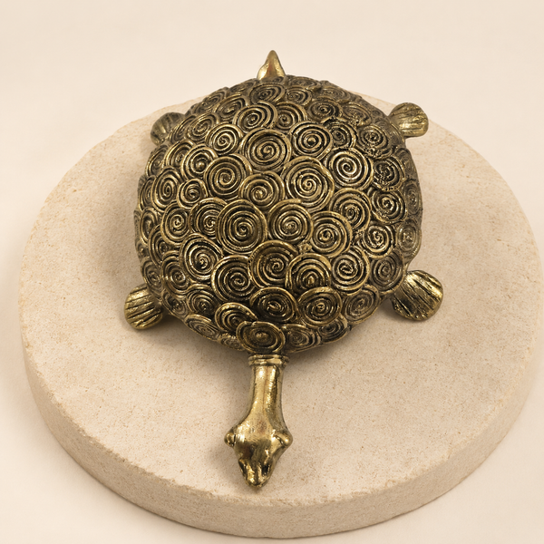 Dhokra Designer Round Turtle on a warm sandstone display plinth