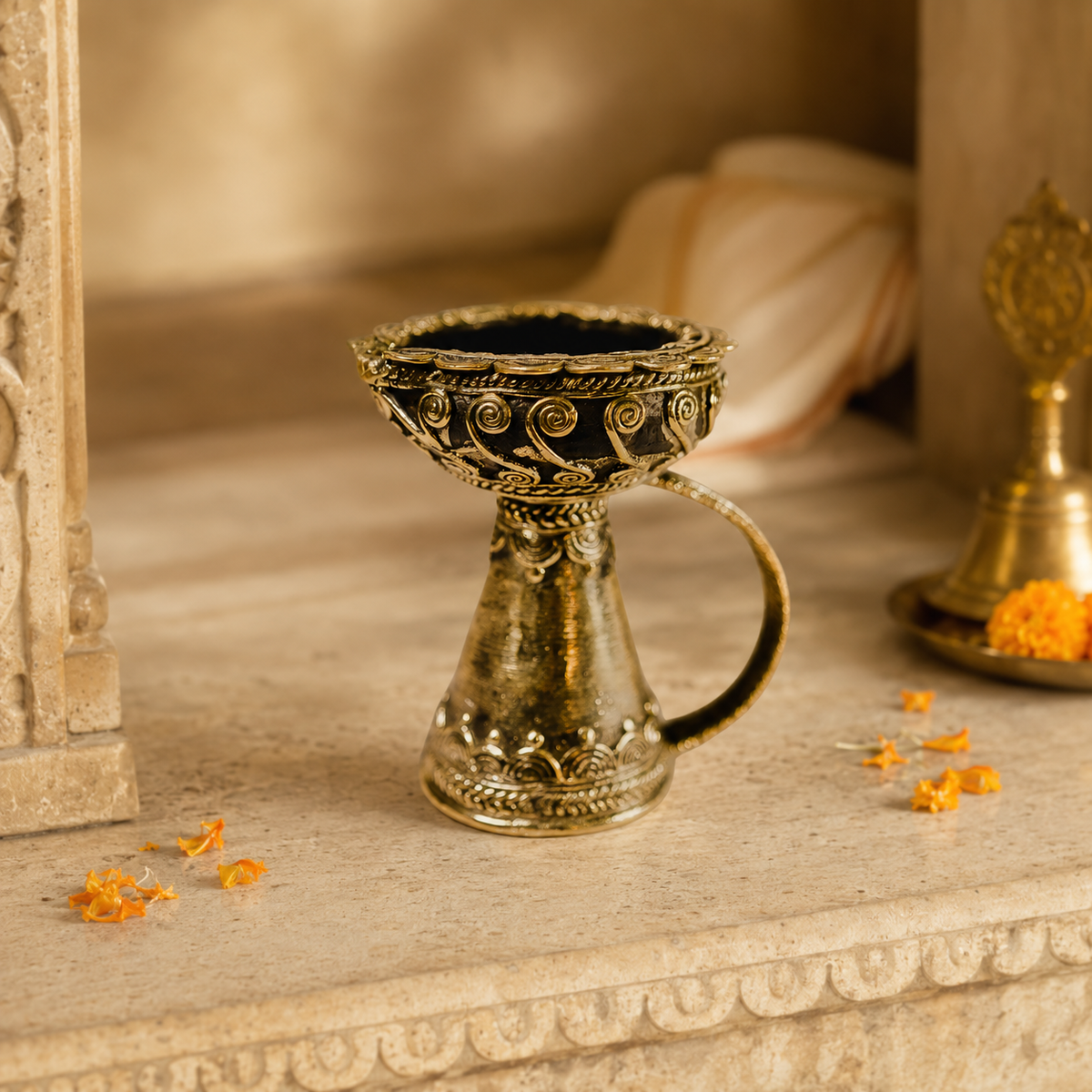 Dhokra brass diya displayed in a warm Indian home temple setting