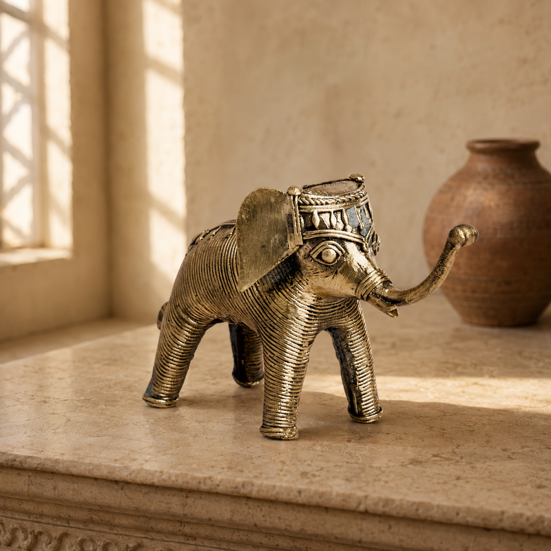 Dhokra Elephant Design 7 styled on a warm stone console in an Indian living room