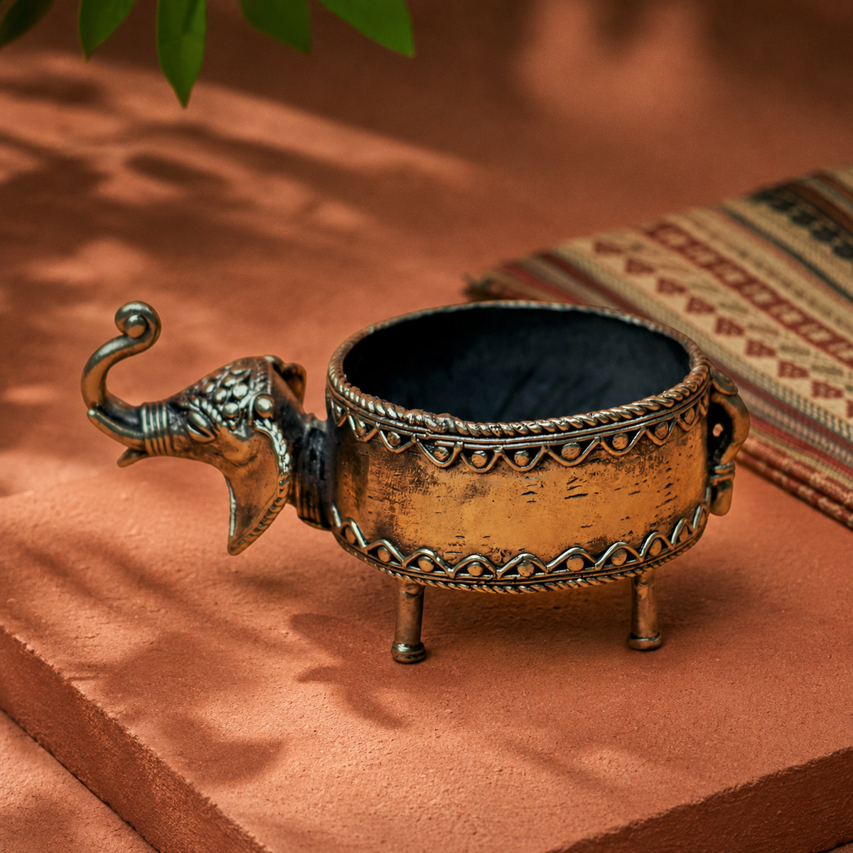 Dhokra elephant dry fruit holder in a warm Bastar-inspired terracotta setting