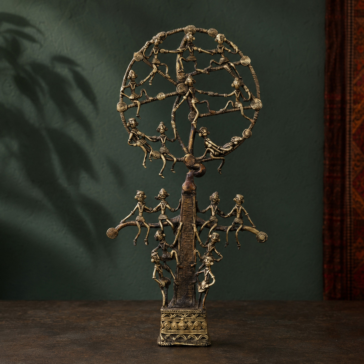 Bastar Dhokra Tree of Life sculpture in a forest-green artisan gallery setting