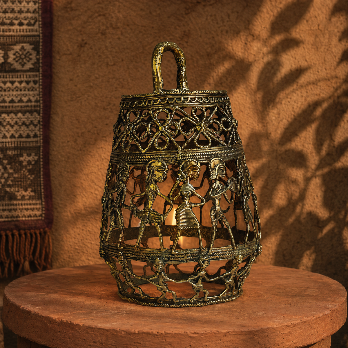 Dhokra Lamp Design 3 on a terracotta plinth in a Bastar-inspired editorial setting