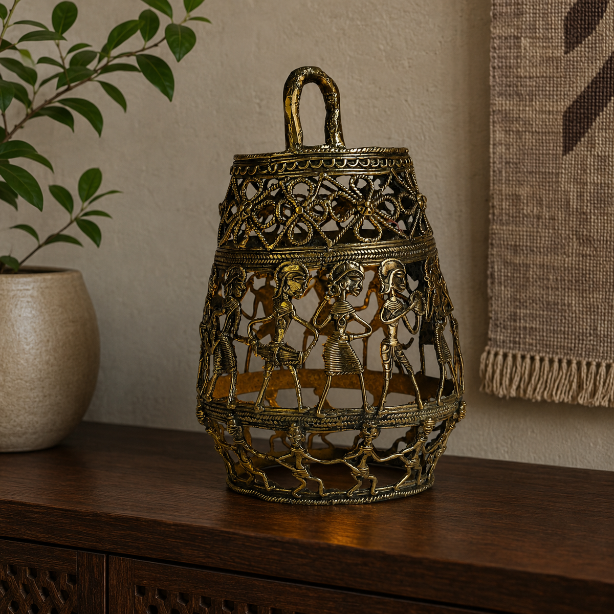 Dhokra Lamp Design 3 displayed with a gentle inner glow on a walnut console