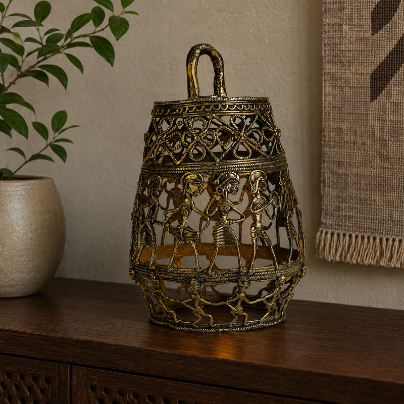 Dhokra Lamp Design 3 displayed with a gentle inner glow on a walnut console