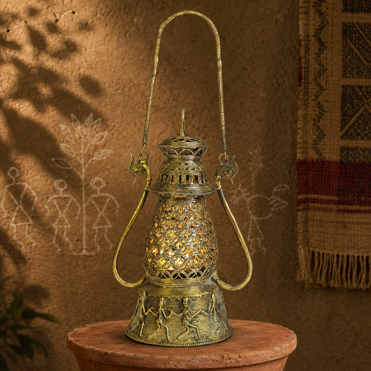 Dhokra Lantern Design 2 on a terracotta plinth in a Bastar-inspired editorial setting