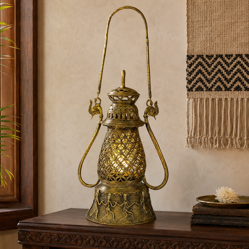 Dhokra Lantern Design 2 glowing gently on a walnut console in a calm interior