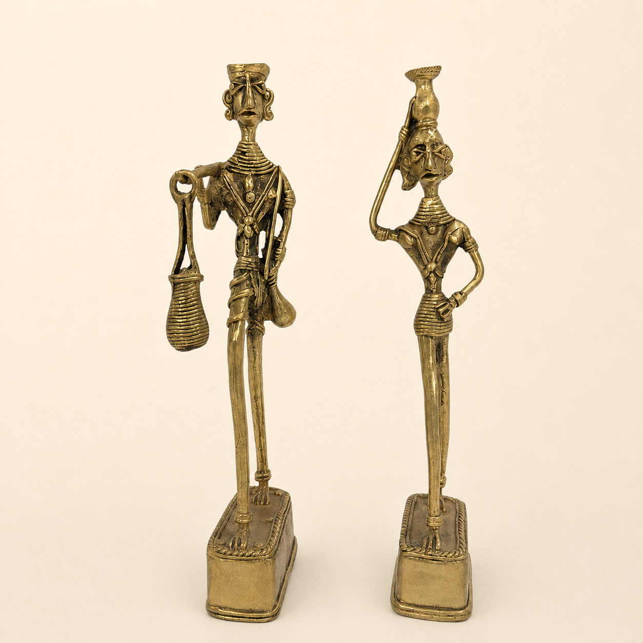 Dhokra Madia Madin tribal couple photographed together on a warm ivory studio background