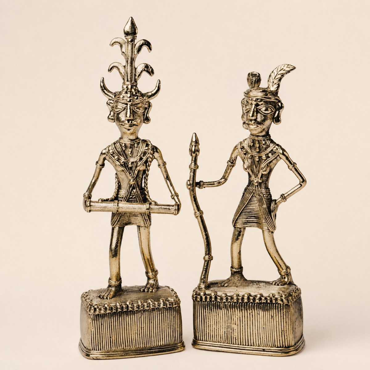 Dhokra Madia-Madin two-figure brass set on a warm ivory studio background
