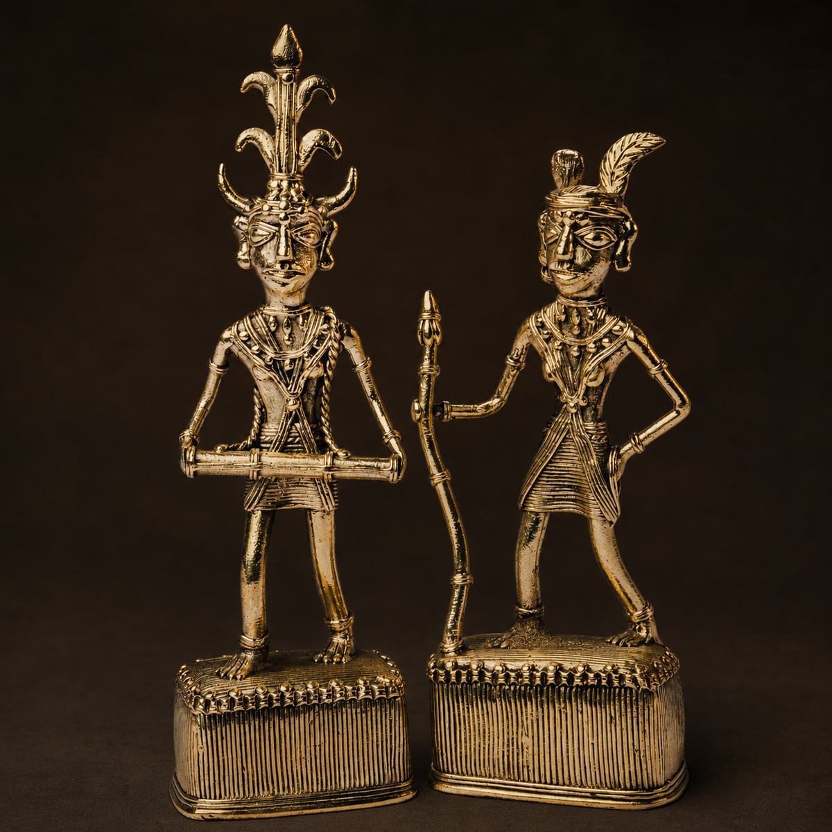 Detailed Dhokra Madia-Madin figures showing headdresses, ornaments, implements and ribbed brass bases