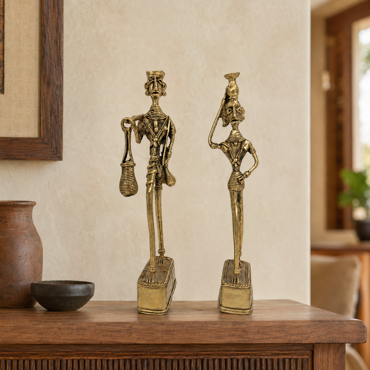 Dhokra Madia Madin brass tribal couple displayed on a wooden console in a warm home