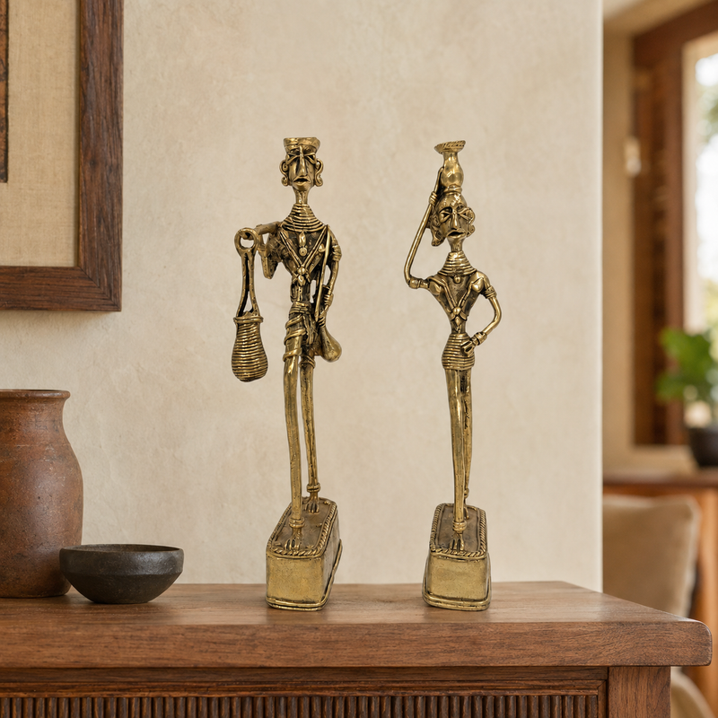 Dhokra Madia Madin brass tribal couple displayed on a wooden console in a warm home
