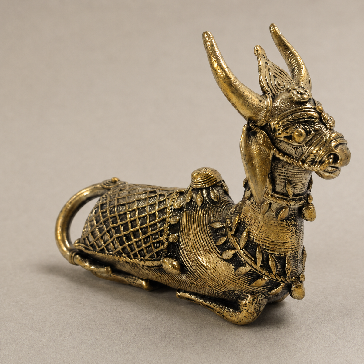 Close view of the lattice body and lost-wax detailing on a Dhokra Mini Nandi