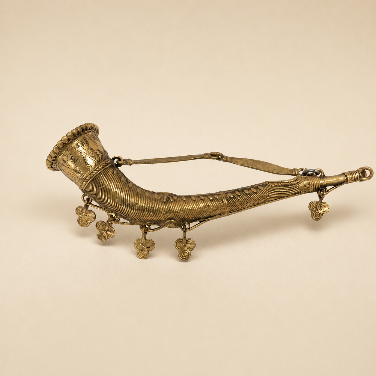 Dhokra Mini Todi brass showpiece on a warm ivory studio background