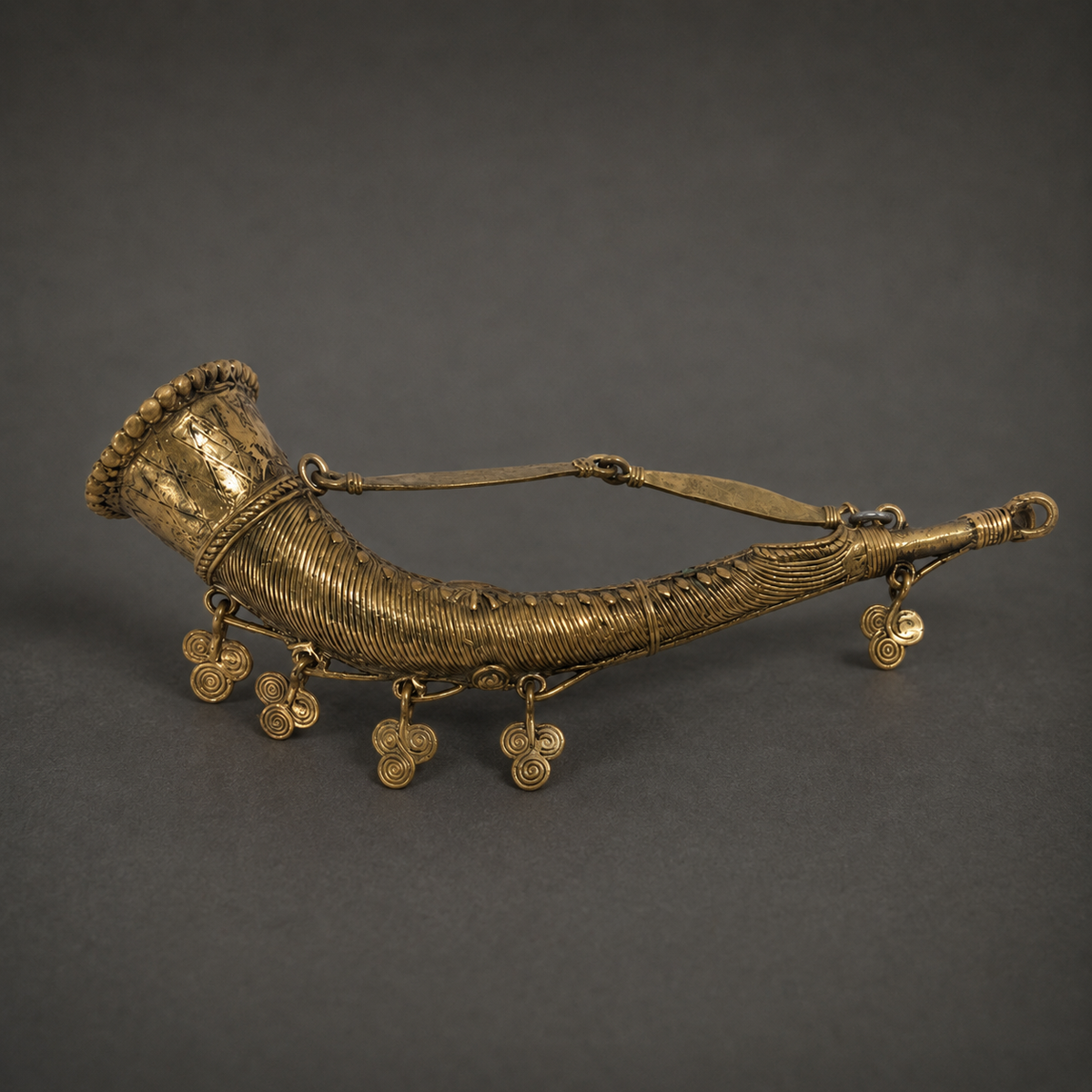 Detailed Dhokra Mini Todi showing ribbed wirework, engraved panels and spiral brass charms