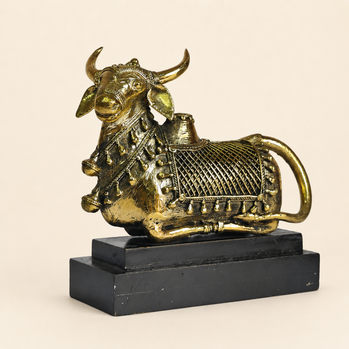 Dhokra Nandi Memento Design 2 on its black stepped base against a warm ivory studio background