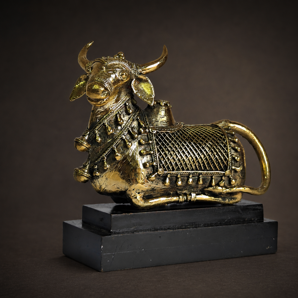Detailed view of Dhokra Nandi Memento Design 2 showing horns, ornaments, lattice body, looped tail and brass texture