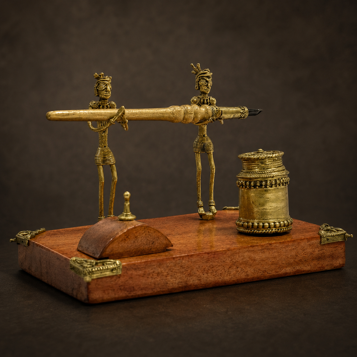 Detailed Dhokra pen stand showing tribal figures, relief metalwork, brass patina and wood grain