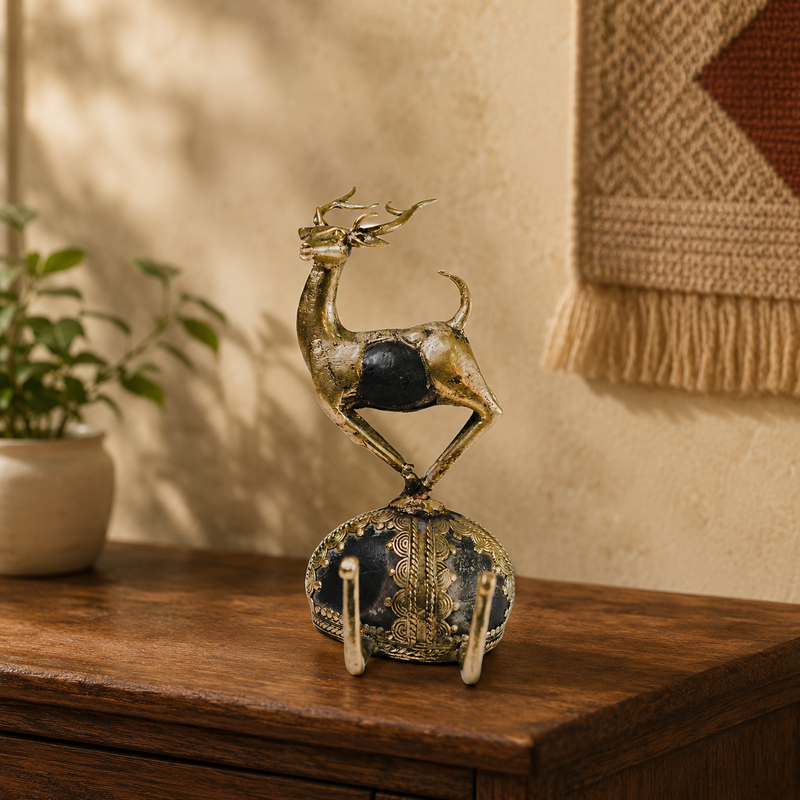 Dhokra brass and stone deer sculpture displayed on a wooden console in a warm home interior