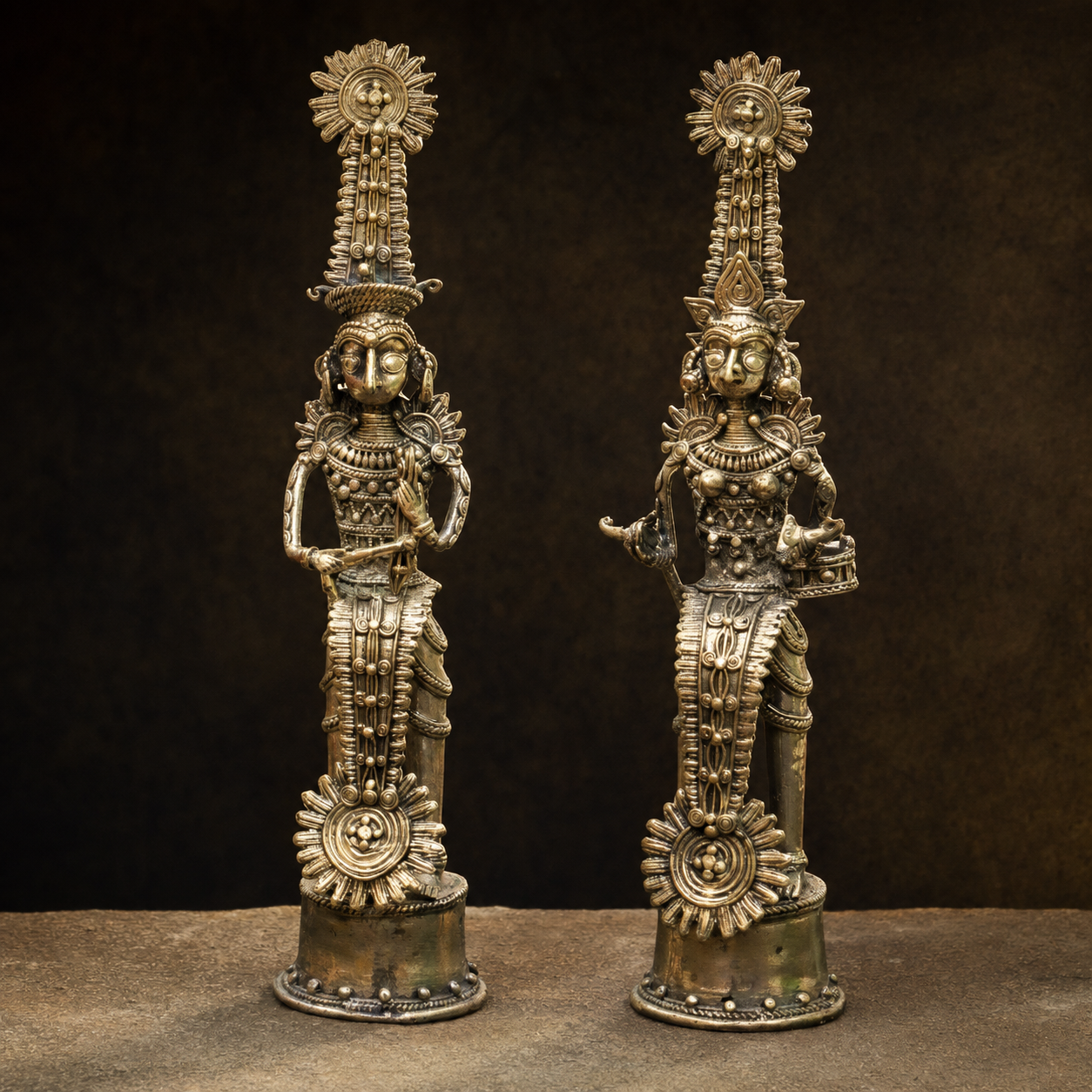 Detailed lost-wax ornamentation and antique brass patina on the Bastar Dhokra ceremonial pair
