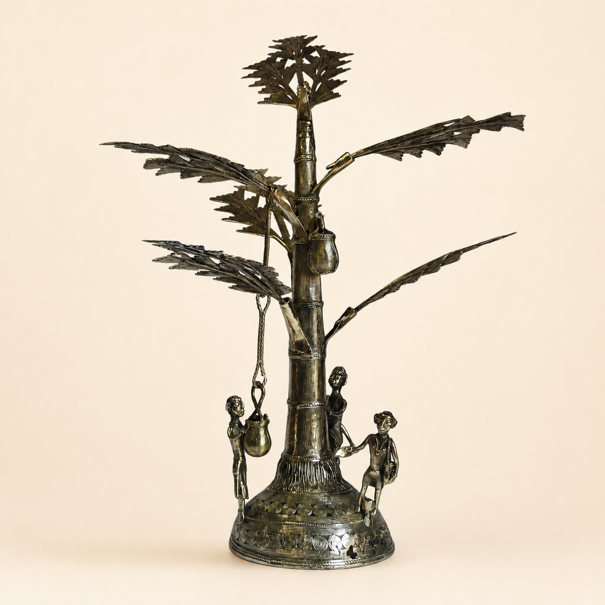 Dhokra Salfi Tree brass sculpture on a clean warm ivory studio background