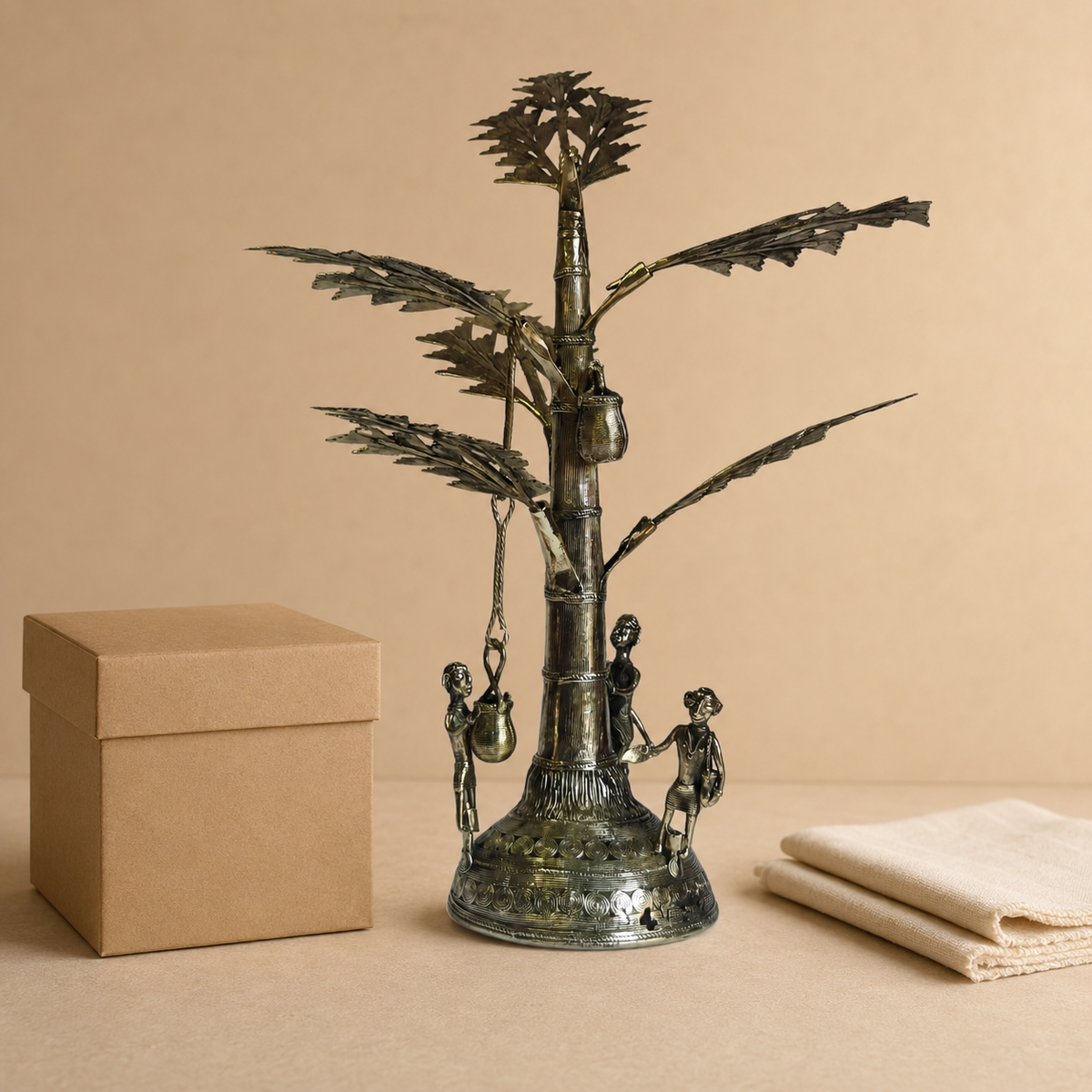 Dhokra Salfi Tree sculpture presented beside a kraft gift box for scale