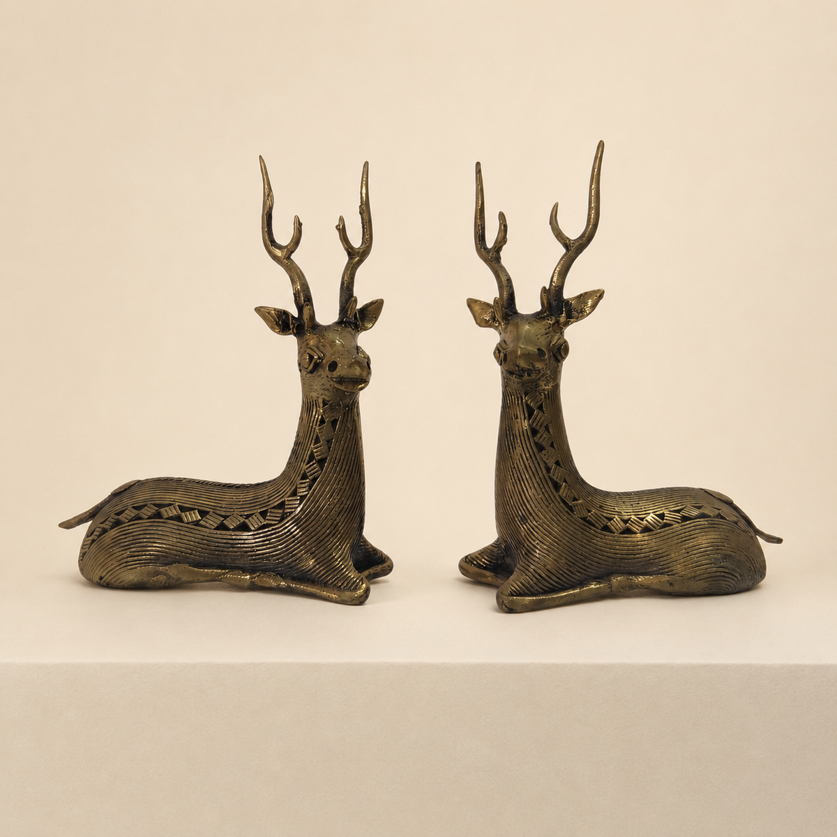 Two-piece Dhokra swamp deer set photographed on a warm ivory studio plinth