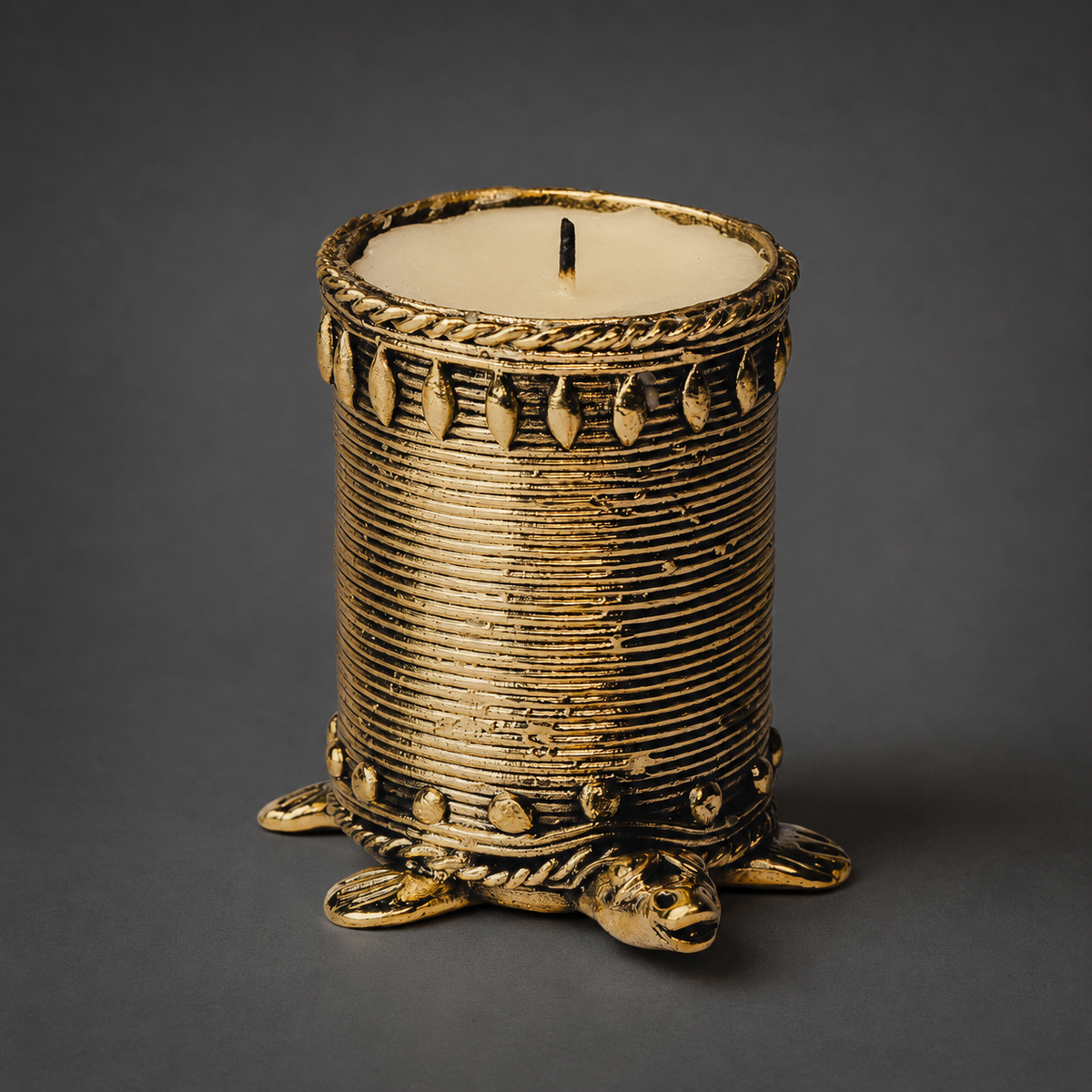 Close product view of the Dhokra tortoise candle holder showing wire texture and brass ornamentation