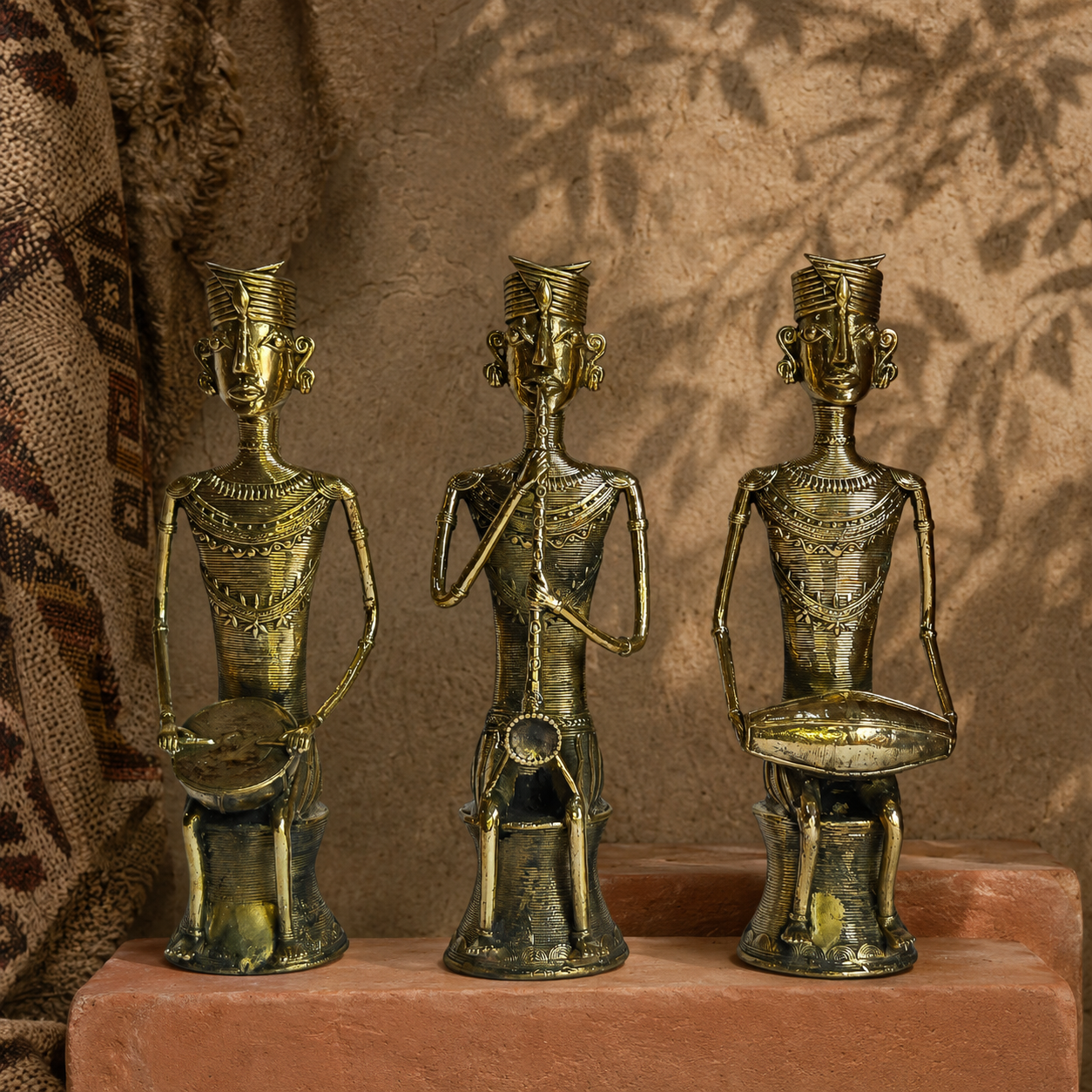 Dhokra Tribal Musician Set on a terracotta plinth in a Bastar-inspired editorial setting
