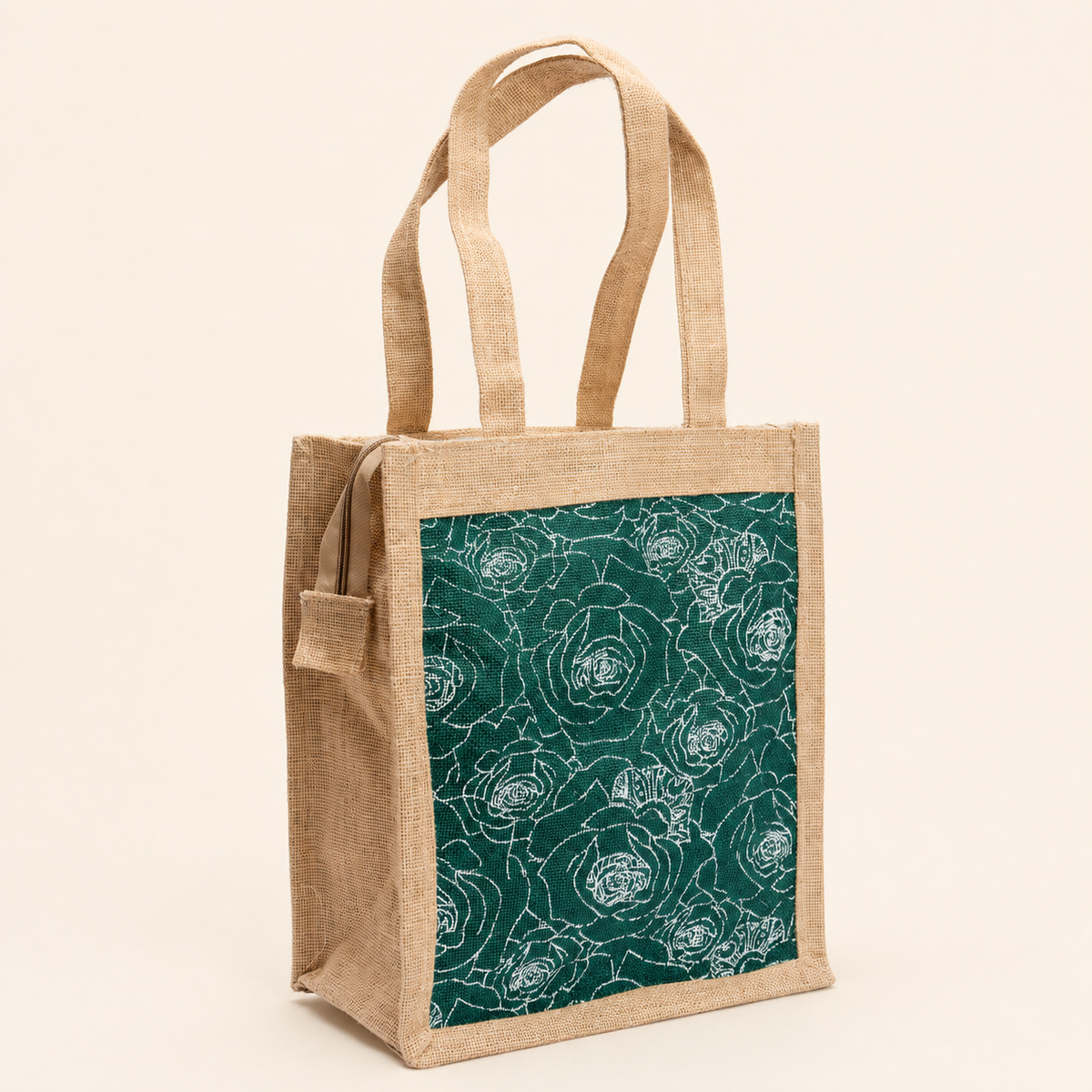 Natural jute tote bag with green rose-print panel on a clean ivory studio background