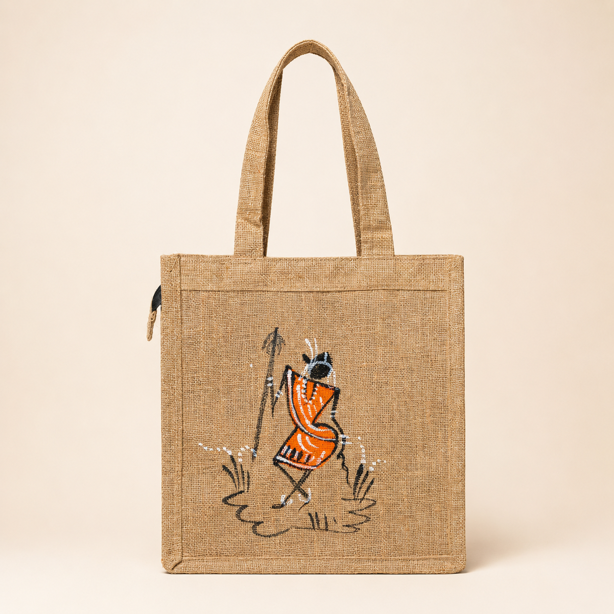 Hand-painted natural jute tote with orange tribal figure on a warm ivory background