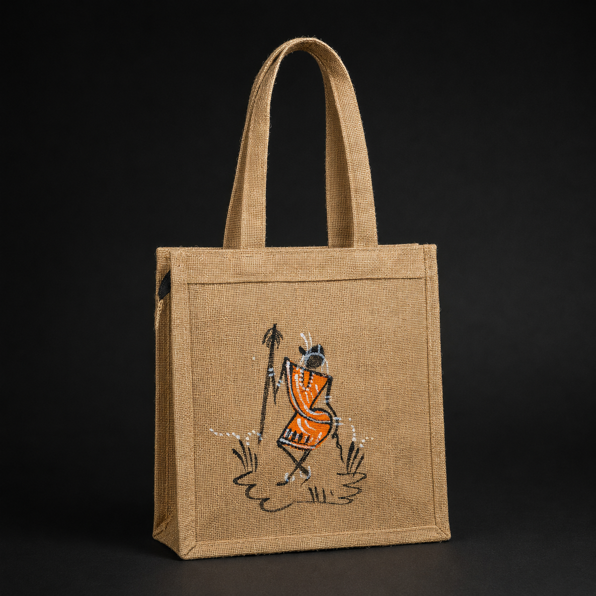 Detailed view of jute fibres, stitching and orange hand-painted tribal artwork