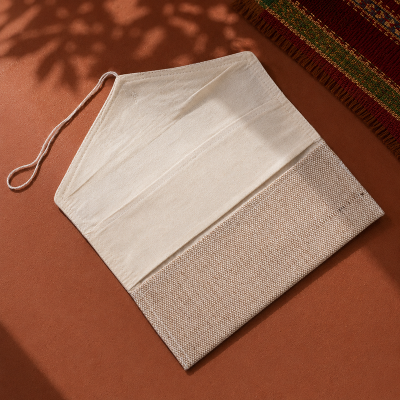 Open jute fabric pouch in a warm Bastar-inspired editorial setting