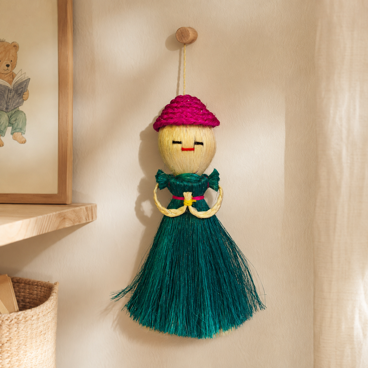 Handcrafted Bastar sisal doll hanging in a warm natural children's reading nook