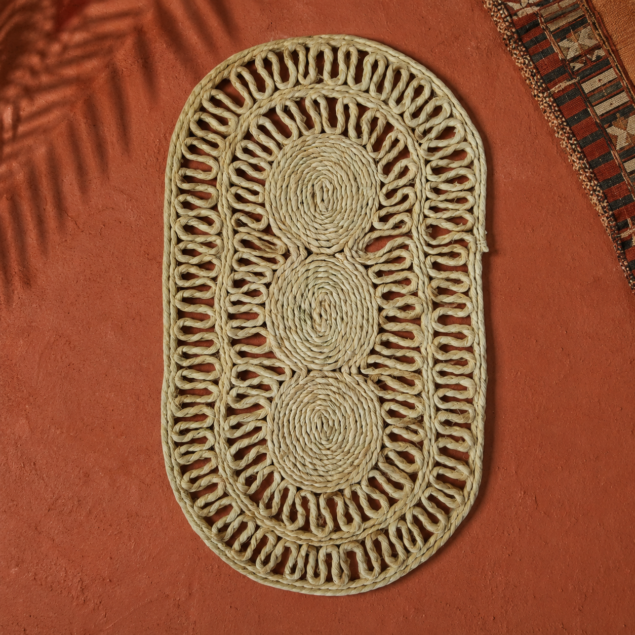 Sisal Table Mat Design 3 in a warm Bastar-inspired editorial setting with textile and leaf shadows