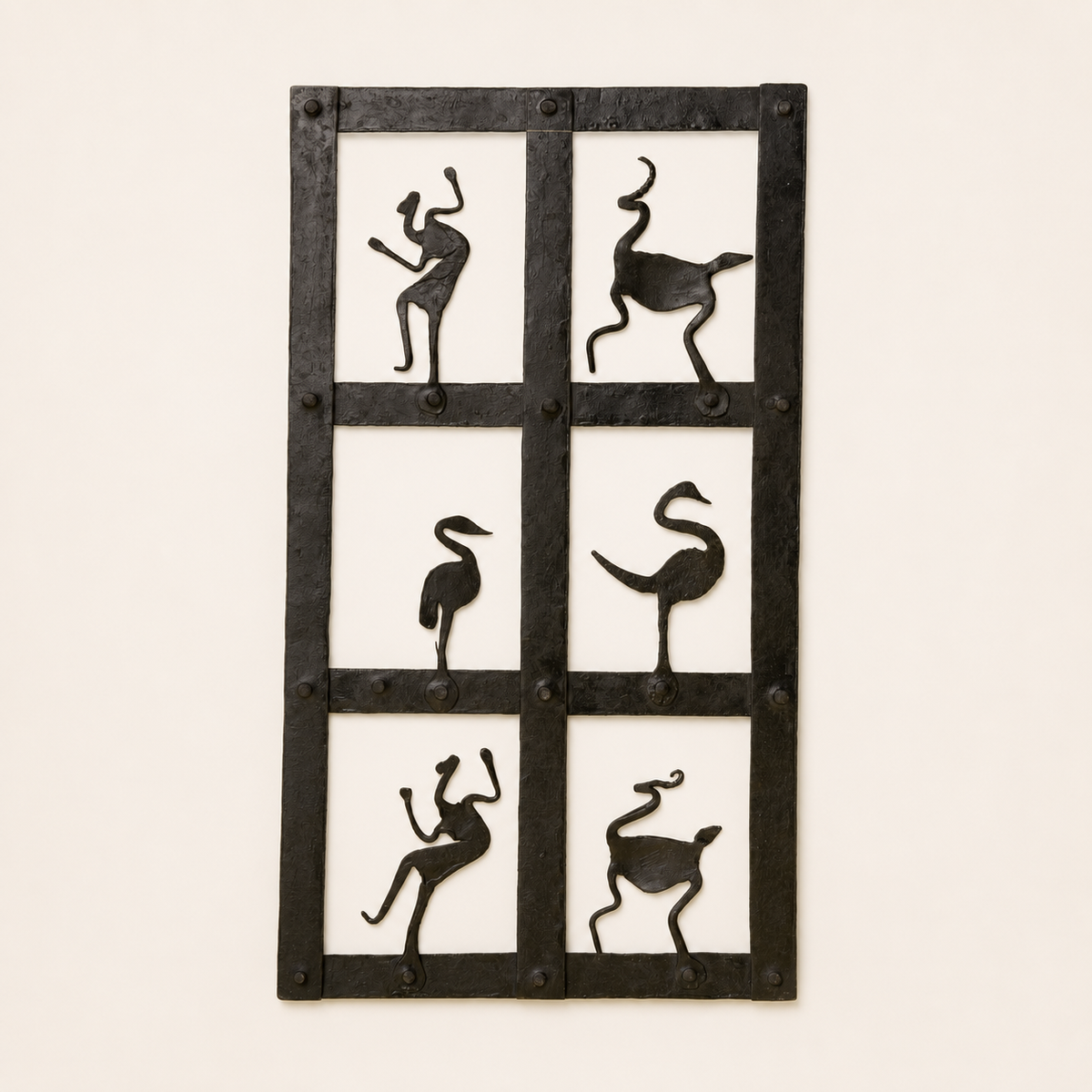 Bastar wrought iron tribal dance wall panel on a clean warm studio background