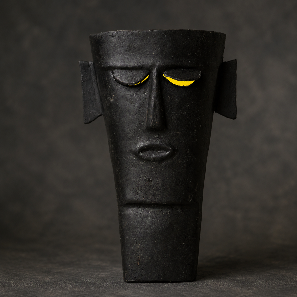 Close craftsmanship view of the blackened iron Bastar tribal face mask
